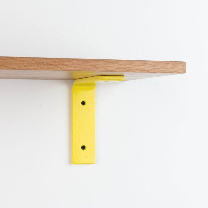 Leif White Oak Wall Shelf with natural white oak and vibrant yellow metal L bracket for bold floating shelf support