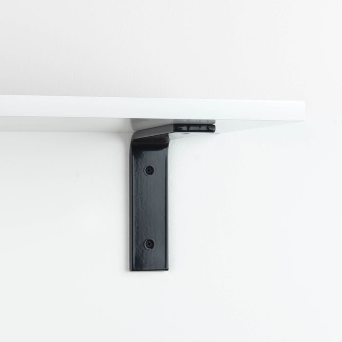 Leif White Wall Shelf with black metal L bracket supporting a sleek white wood floating shelf for modern wall organization