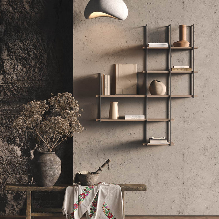 Lloyd White Oak 5 Tiered Shelf with natural wood ledges and dark metal brackets styled with books and pottery on textured wall