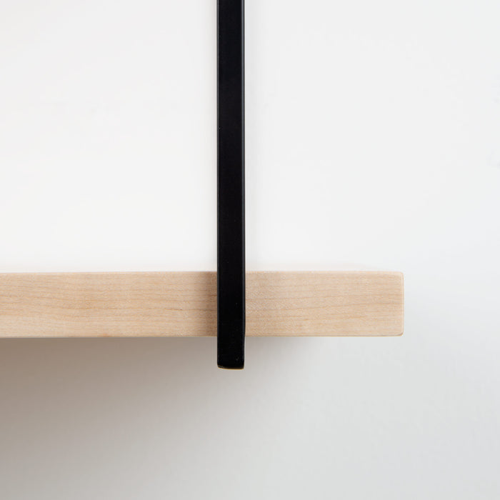 Lloyd Maple 5 Tiered Shelf close-up showing natural maple wood ledge with minimalist black metal floating shelf bracket detail