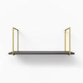 Lloyd Tungsten Tiered Shelf with dark gray ledge and gold metal floating shelf brackets for minimalist wall display