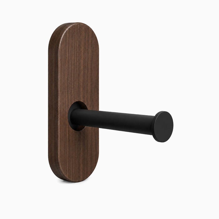 Lou Toilet Paper Holder featuring a walnut wood backplate with a matte black metal rod, designed for minimalist wall organization.