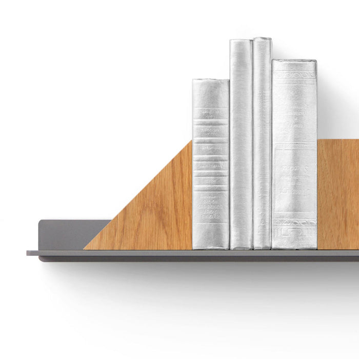straight on image of a tromso shelf holding 4 silver books supported by a triangle and a square maggie bookend product.