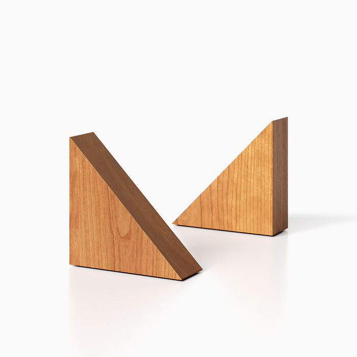 The Maggie triangle Product (cherry finish) pictured against a white background. Two bookends positioned in the center, one slightly off center, in front of the other.