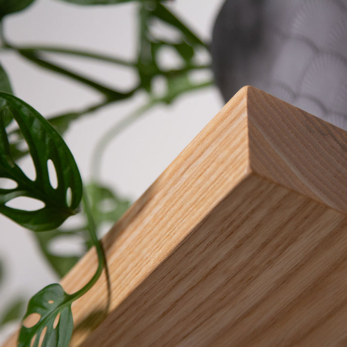 Close-up of a corner on an Unfinished White Oak Wood Slab showcasing smooth solid hardwood grain and clean edges for custom floating shelves and display ledges.