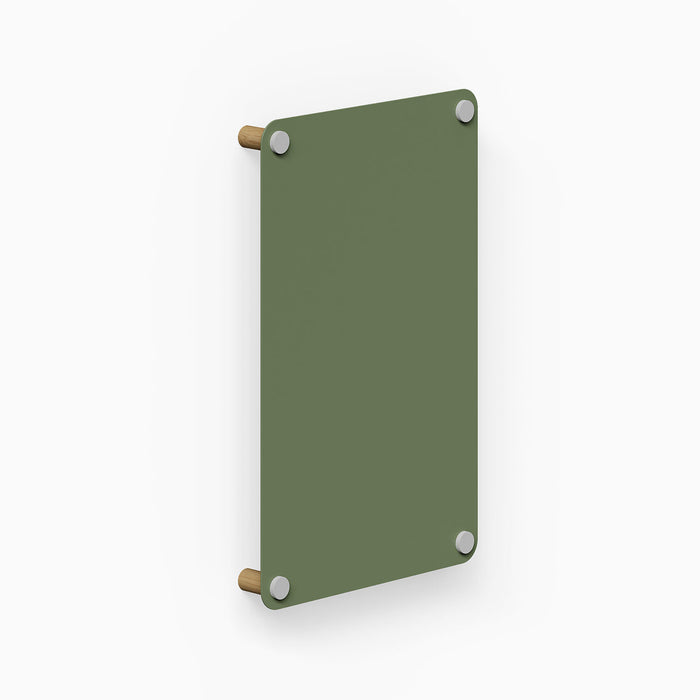 Morgan Magnet Board in muted green with rounded corners, featuring a minimalist design with wooden mounting pegs and steel magnets for wall organization.