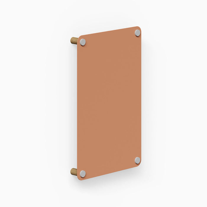 Morgan Magnet Board in clay color mounted on a wall with wooden supports, showcasing minimalist design and durable materials.