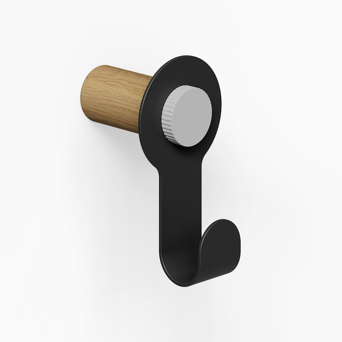 Morgan Pegboard Hook in black metal with a natural wood back, designed for minimalist wall organization and durable display solutions.