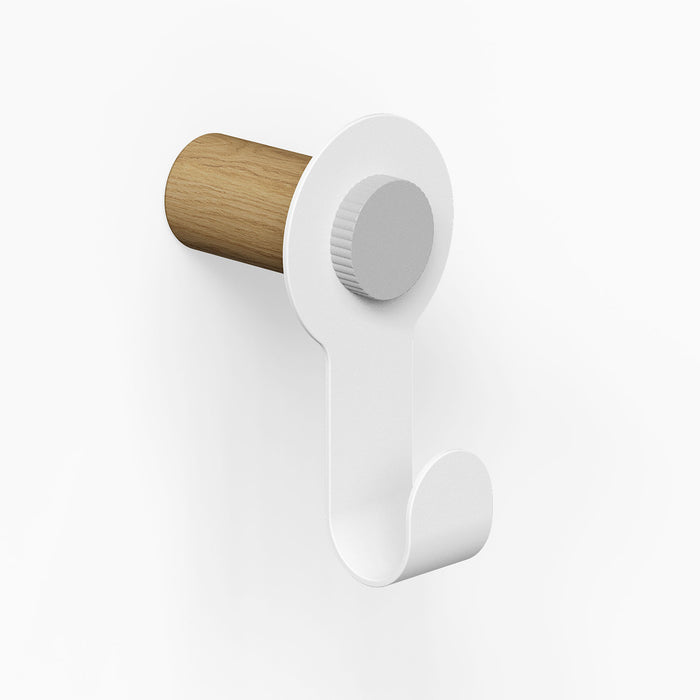 Morgan Pegboard Hook featuring a minimalist white metal hook with a solid hardwood peg, designed for stylish wall hooks and organization.