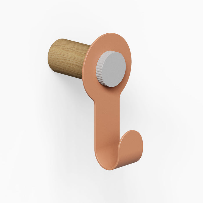 Morgan Pegboard Hook with a minimalist design featuring a clay-colored metal hook and a solid hardwood peg for durable wall organization.