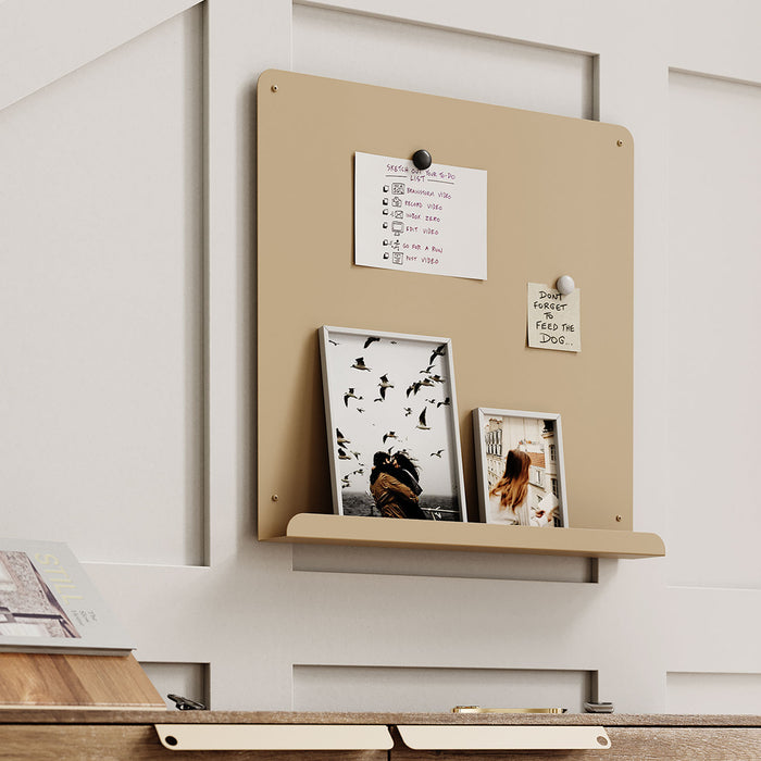 Mosey Ledge Magnet Board in warm beige with a slender ledge and magnetic surface holding notes and photos