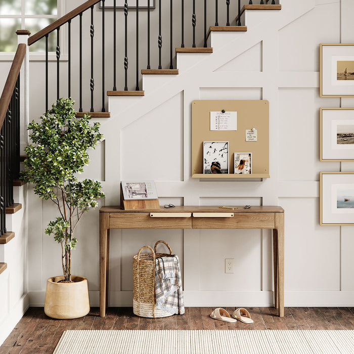 Mosey Ledge Magnet Board in soft dune beige mounted above a wooden console table with notes and photos displayed