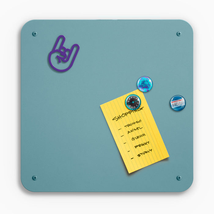 Mosey Magnet Board in muted teal steel with rounded corners holding shopping list and assorted magnets by Shelfology