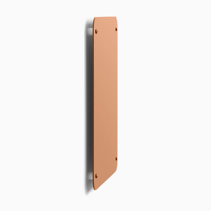 Mosey Magnet Board in terracotta steel shown from side with slim profile and secure wall mounting by Shelfology