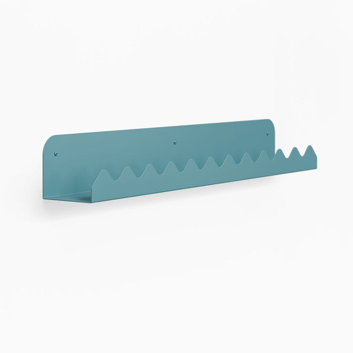 Mountain Picture Ledge with blue metal finish and wave-cut edge designed for stylish shelf and wall display by Shelfology