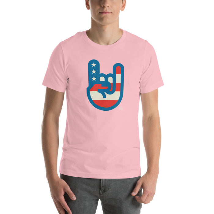 Murica T-shirt in soft pink with a bold red, white, and blue patriotic hand graphic by Shelfology