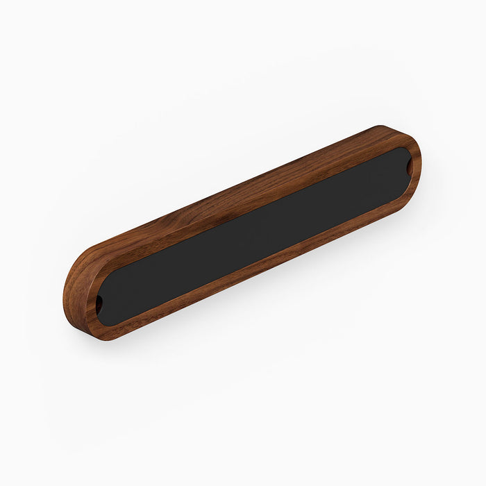 Nico Knife Rail with a minimalist walnut wood frame and black steel center, designed for elegant and functional wall storage in kitchens.
