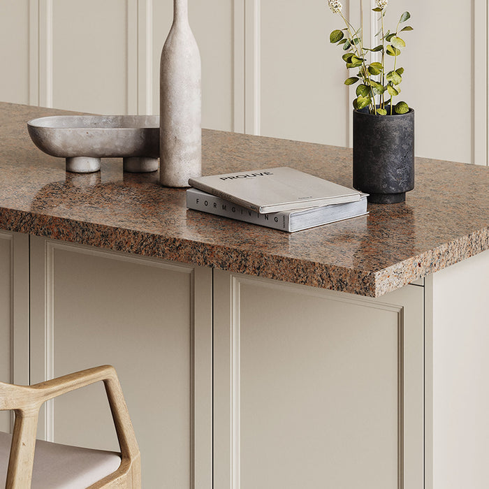 Otto Countertop Bracket supporting a thick granite surface over cream cabinetry, highlighting durable mixed-material design for functional kitchen storage and display.