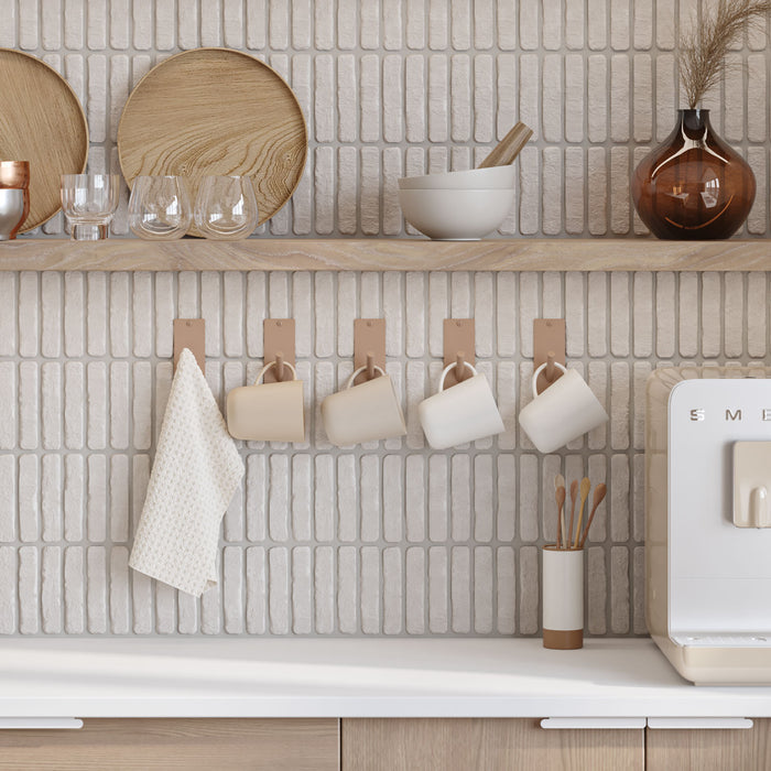 Peggy Square 1 Wall Hook in light tan with minimalist design holding kitchen mugs and a towel by Shelfology