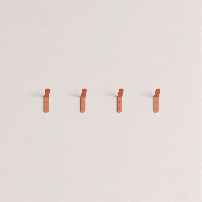 Popsicle Wall Hook in warm terracotta steel with clean lines and two mounting holes for secure wall organization by Shelfology