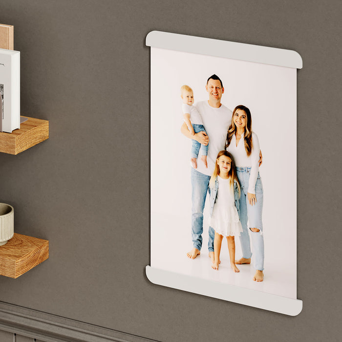 RADius Magnetic Print Hanging System in matte white steel displaying a clean family portrait on a dark wall background