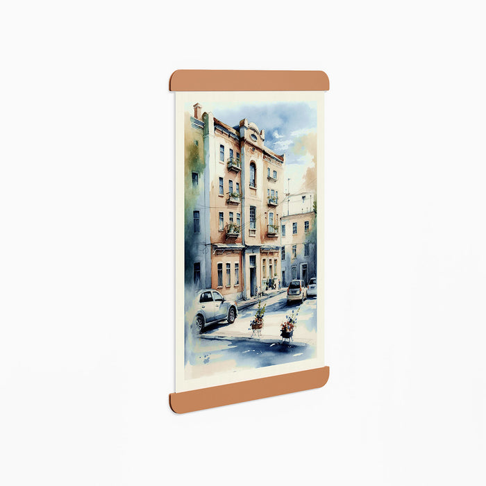 RADius Magnetic Print Hanging System in warm clay steel displaying an urban watercolor artwork on a white wall