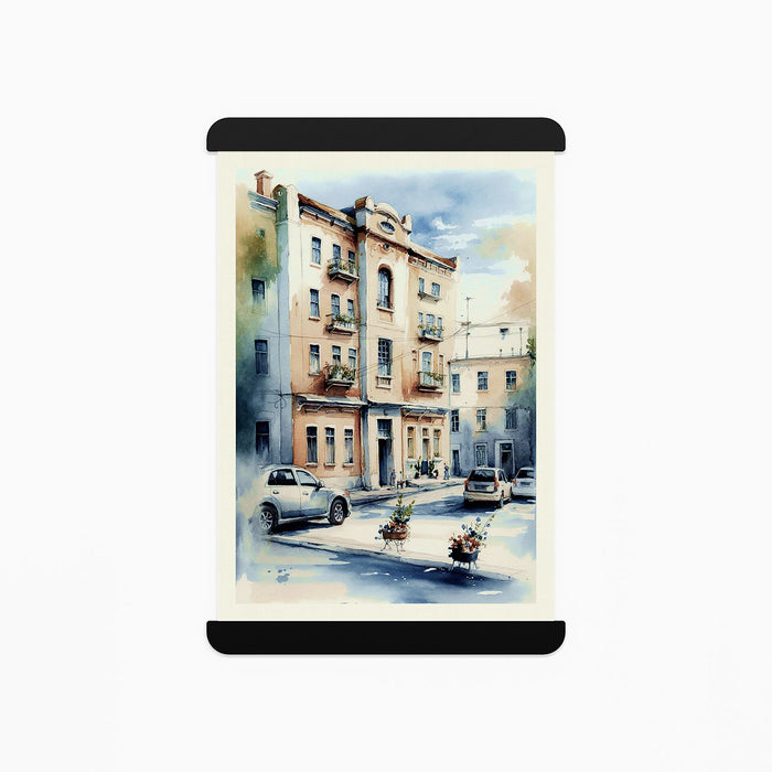 RADius Magnetic Print Hanging System in matte black steel holding a detailed urban watercolor scene with soft sunlight contrasts