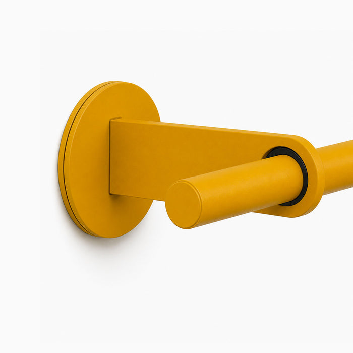Ringo Curtain Rod Kit in matte mustard yellow finish featuring a sleek, minimalist wall-mounted rod and bracket for functional, stylish window treatment display.