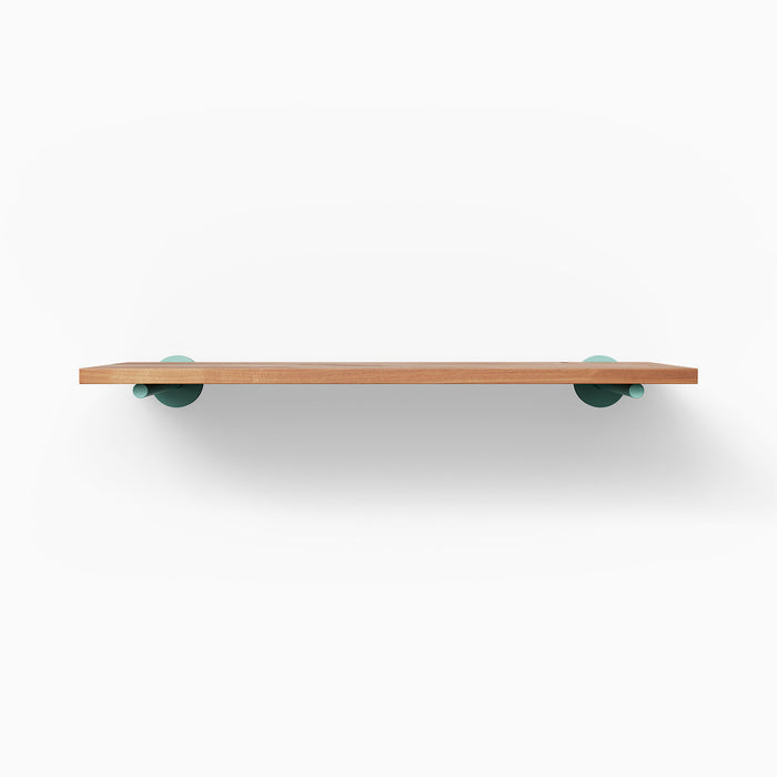 Roderick Alder Wall Shelf with smooth alder wood surface and muted teal floating shelf brackets for subtle wall display