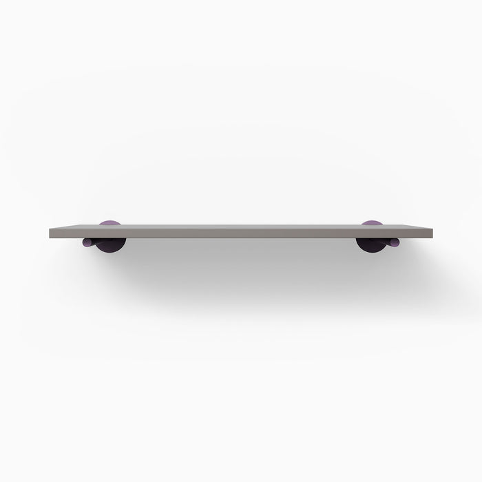 Roderick Arsenic Wall Shelf with matte arsenic surface and round purple metal floating shelf brackets for sleek display