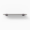 Roderick Arsenic Wall Shelf with matte arsenic surface and round purple metal floating shelf brackets for sleek display