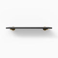Roderick Black Wall Shelf with sleek black hardwood and round gold metal floating shelf brackets for elegant display