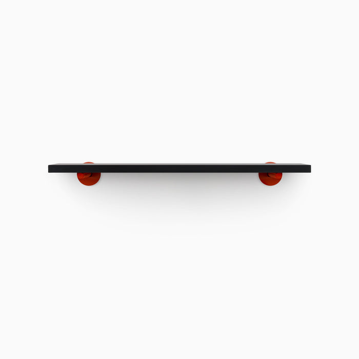Roderick Black Wall Shelf with smooth black hardwood and bold red round metal floating shelf brackets for modern display