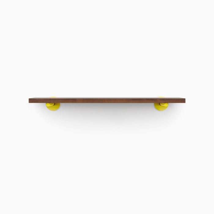 Roderick Espresso Wall Shelf with smooth espresso hardwood and bold round yellow metal floating shelf brackets for vibrant display