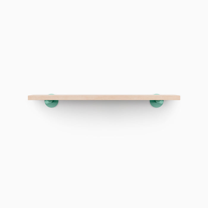 Roderick Glazed White Oak Wall Shelf with smooth hardwood and vibrant round pastel green metal floating shelf brackets for display