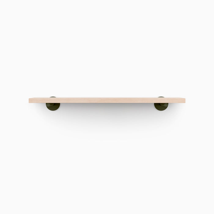 Roderick Glazed White Oak Wall Shelf featuring smooth white oak with round olive green metal floating shelf brackets