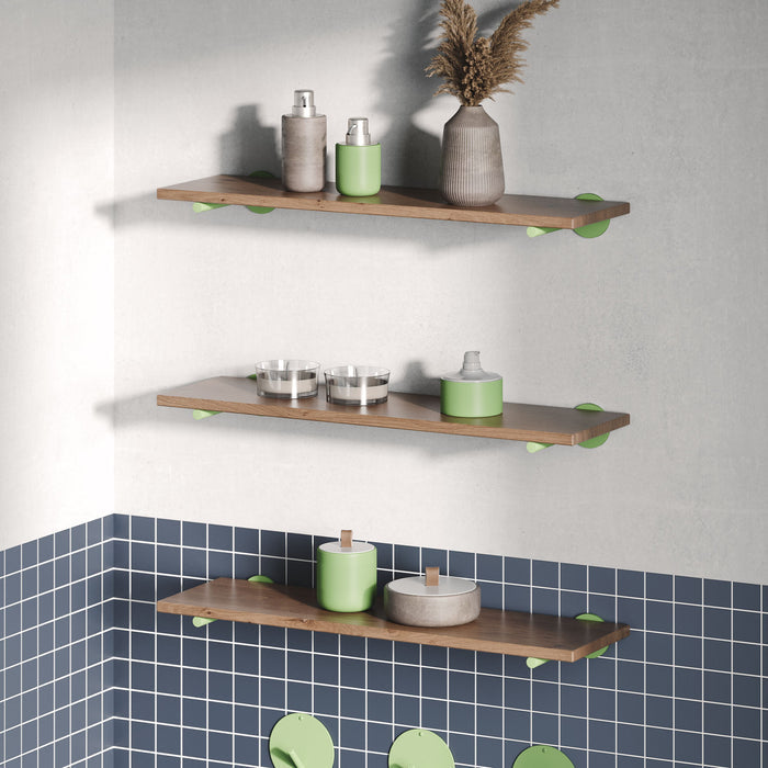 Roderick Nutmeg Wall Shelf with textured nutmeg hardwood and round green metal floating shelf brackets for wall display