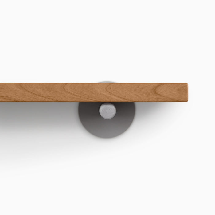 Roderick Nutmeg Wall Shelf with smooth nutmeg hardwood and round arsenic gray metal floating shelf bracket detail