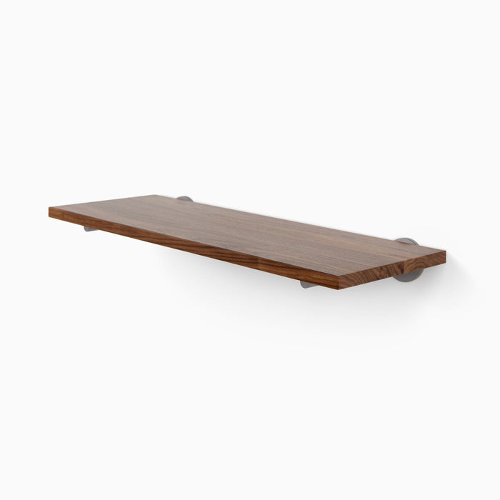 Roderick Walnut Wall Shelf with smooth walnut finish and discreet metal floating shelf brackets for sleek display and organization