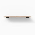 Roderick White Oak Wall Shelf with smooth white oak finish and round black metal floating shelf brackets for modern display