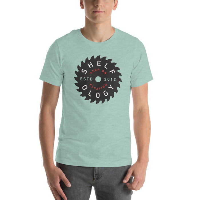 Rough Sawn T-shirt in light green with circular saw blade logo and red "Keep on Floating" text, unisex fit by Shelfology