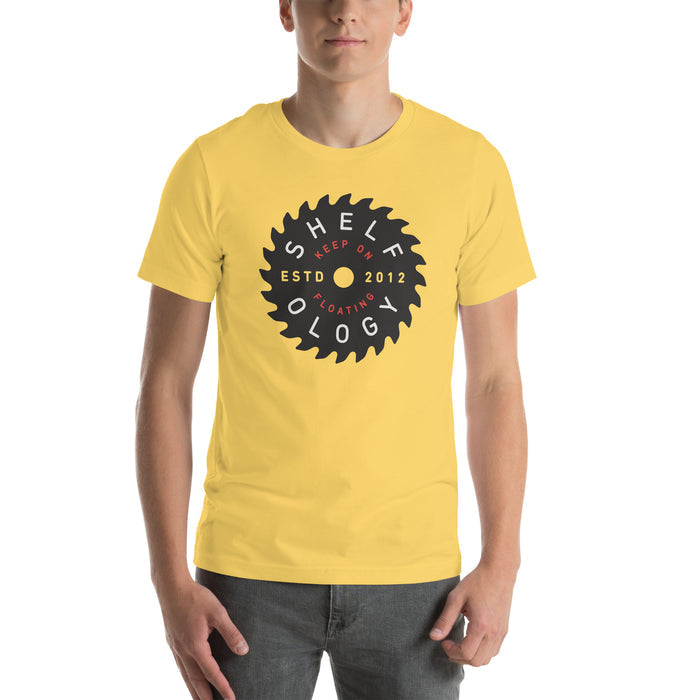 Rough Sawn T-shirt in bright yellow with bold circular saw blade logo and red text, unisex casual fit by Shelfology