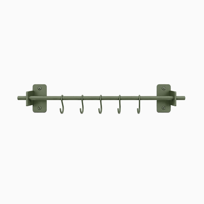 Rue Utensil Rack in muted green with six hooks, durable metal design ideal for organizing kitchen tools or hanging wall accessories.