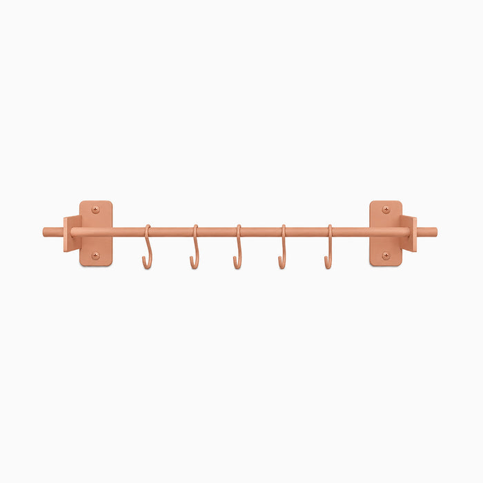 Rue Utensil Rack in matte clay color with six hooks designed for maximizing wall space and organizing kitchen tools efficiently.