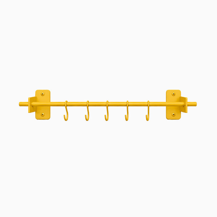 Minimalist honey mustard Rue Utensil Rack with six hooks, designed for efficient wall organization and durable, rust-resistant use.