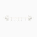 Rue Utensil Rack in white metal with six hooks, designed for minimalist wall organization and durable, functional kitchen storage.