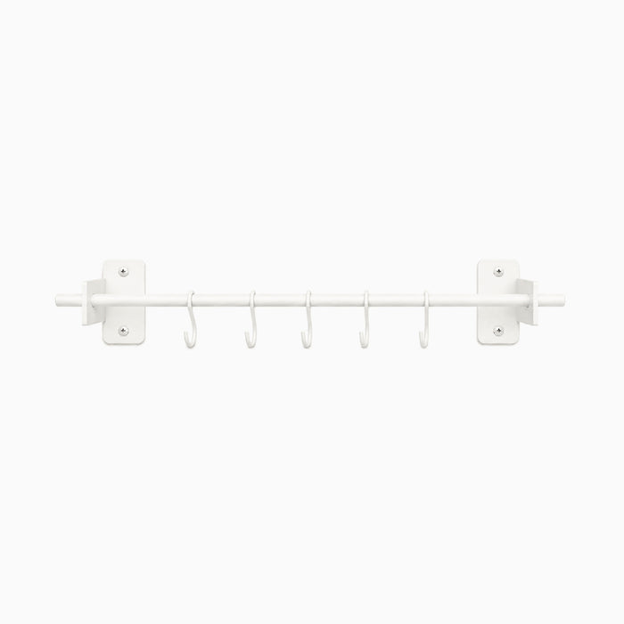 Rue Utensil Rack in white metal with six hooks, designed for minimalist wall organization and durable, functional kitchen storage.