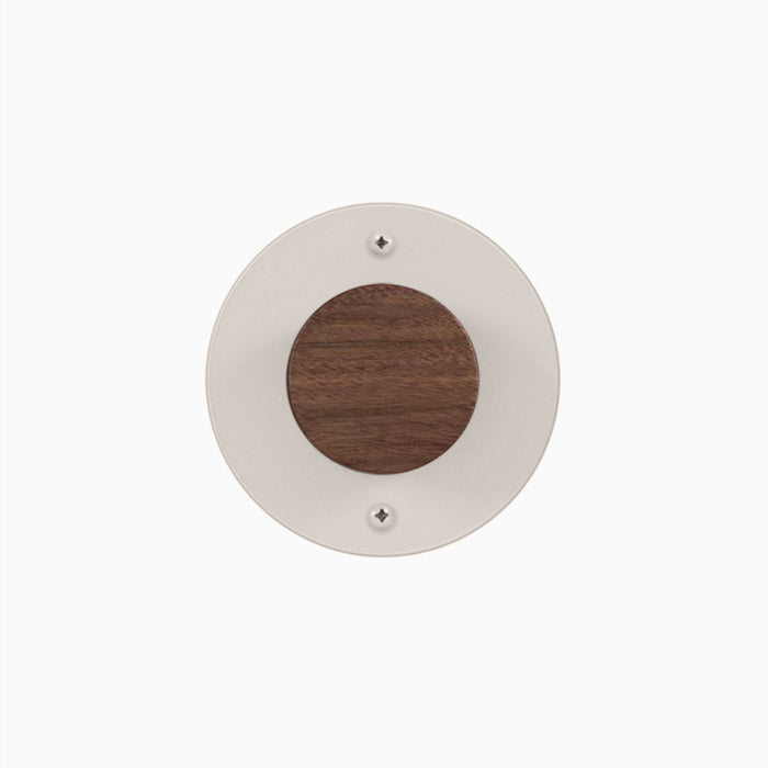 Runda Coat Rack 1 in walnut wood center with white round metal base for minimalist wall hooks and hangers