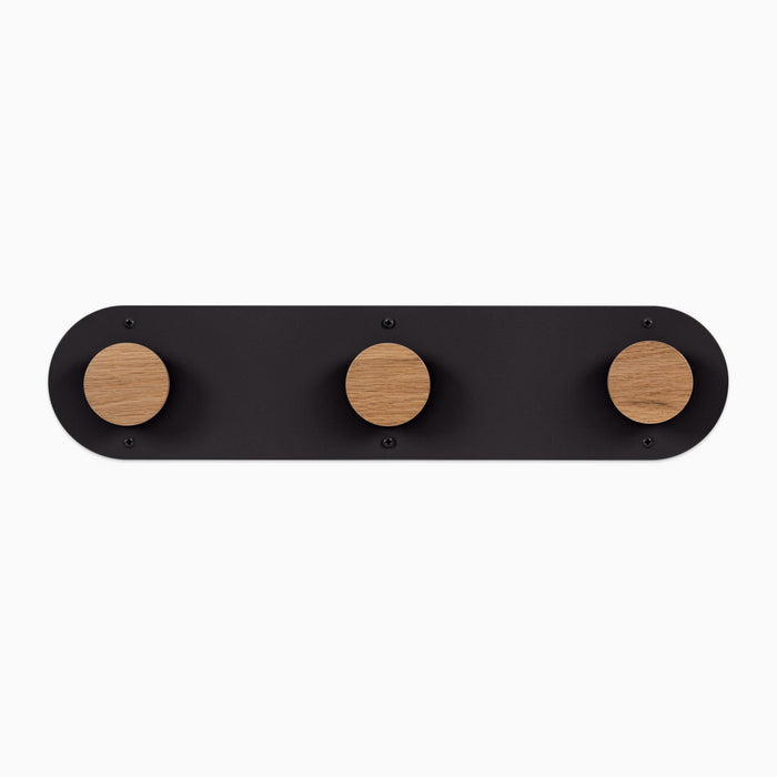 Runda Coat Rack 3 with solid hardwood pegs and rust-resistant black steel base for sleek wall hooks and organization