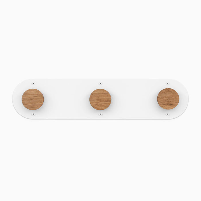 Runda Coat Rack 3 with solid hardwood pegs and smooth white steel base for minimalist wall hooks and organization